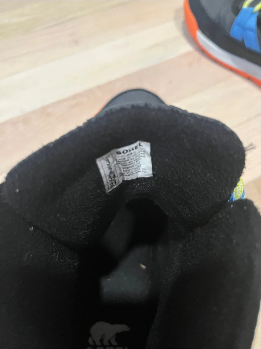 Sorel Kids Black Boots with Blue Stripes and Orange Sole